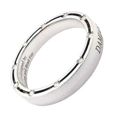 Authentic Damiani Brad Pitt 18k White Gold 20 Diamond 4mm Band Ring Sz 8.25  Retail Price: $2,850  Metal: 18k White Gold  Measurements:  Weight: 6.4 grams  Width: 4mm  Size: 8.25  Stones: 20x round old European cut diamond E-G color, VS-SI clarity total weight approx. .10ct  Hallmarks: Damiani co-designed Damiani and Brad Pitt 750 Made in Italy  Dimensions reference the ring size and are not specific to the ring itself. Designer Diamond Ring With Polished Finish For Anniversary, Luxury Polished Finish Diamond Promise Ring, Designer Rings With Polished Finish For Anniversary, Designer Round Diamond Ring Hallmarked, Luxury White Gold Rings With Channel Set, Luxury White Gold Engraved Ring With Diamond Cut, Luxury Diamond Engraved Ring Hallmarked, Designer Hallmarked Diamond Ring, Designer Round Diamond Ring For Anniversary