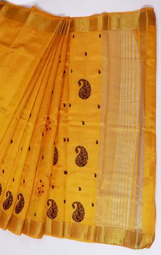 This Saree is Ready to Wear (With Fall and Pico Done). A designer saree in Yellow Color. It has intricate design all over the saree. This saree is a suitable amalgamation of style and grace that is required from an ethnic wear. The saree is ideal for any formal gathering. The saree comes with an unstitched blouse of corresponding color and design as shown in the picture. Silk Designer Yellow Color Saree Fabric Type: SilkPrimary Colour: YellowSecondary Colour(s): GoldenSaree Length: 6.0 meters including 0.8 meter blouseBlouse Material: Matching Silk (Same as picture)Washing Instructions: Dry Clean Only Festive Yellow Saree With Resham Embroidery, Yellow Saree With Resham Embroidery, Festival Pre-draped Saree With Self Design, Gold Pre-draped Saree With Motifs, Semi-stitched Tussar Silk Churidar For Festivals, Saree Sets With Motifs For Celebration, Celebration Saree Sets With Motifs, Unstitched Bollywood Slub Silk Saree, Yellow Embroidered Unstitched Saree Fabric