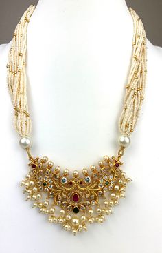 Beautiful pearl mala set in 1 gram gold with premium 24 micron plating. High quality pearls, cubic zirconia, rubies and emeralds. Comes with very cute pearl earrings. Looks exactly like 24 Kt gold! Mala Set In Gold, Gold Mala Designs, Pearl Haram, Pearl Necklace Indian, Pearl Mala, Temple Jewelry Necklace, Gold Temple Jewellery, Delicate Gold Necklace, Contemporary Necklace