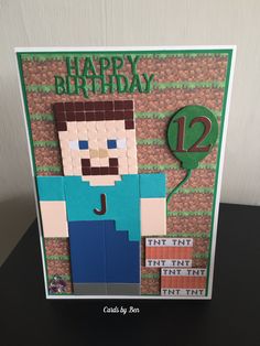 a birthday card with a paper cut out of a man holding a balloon and the words happy birthday