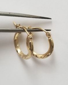 "Thanks for shopping our vintage estate store. We tend to sell well below wholesale and truly hope you enjoy all of our items. Many of the items are one of a kind, so please enjoy scrolling through the pictures and hopefully something will catch your eye. Brown spots are from camera. Beautiful estate new 14k yellow gold small diamond cut hoops. Did not see any damage to the hoops. Length: 1/2\" Width: 1/2\" Thickness: 2mm 1/16\" Weight: .71 gram Beautiful hoops with unique detail. Someone will l Heart Anklet, Earrings Diamond, Brown Spots, Pearl Stud Earrings, Feather Earrings, Style Earrings, Pearl Studs, Cut Design, Diamond Cut