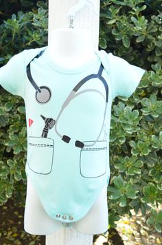 Dr or Nurse baby bodysuit or costume by doodledees on Etsy Cute Fitted Bodysuit With Cartoon Print, Fitted Onesie With Character Print For Playwear, Fitted Character Print Onesie For Playwear, Playful Short Sleeve Bodysuit With Character Print, Fun Onesie For Playtime, Cute Character Print Onesie For Playwear, Cute Character Print Onesie For Play, Fitted Cartoon Print Onesie With Short Sleeves, Cute Fitted Bodysuit For Playtime