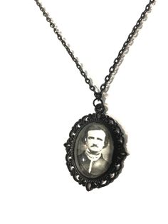 Edgar Allen Poe, a classic, gothic literary genius enthralled us with his dark poetry and short stories of horror and woe. A handmade photo pendant necklace measuring 50cm in length. The pendant inner photo image measures 25 x 18 mm and is set behind glass in a black filigree oval pendant frame. The necklace is set with a lobster clasp closure. Thank you for looking  pleas follow my Instagram @helloween_13 for upcoming products and updates Black Round Pendant Necklace For Memorial, Black Collectible Necklace For Halloween, Black Engraved Necklace For Halloween, Black Pendant Necklace For Memorial, Black Round Pendant Necklace Collectible, Black Cameo Medallion Necklace, Black Cameo Necklace Gift, Black Cameo Necklace As A Gift, Black Cameo Necklace For Gift