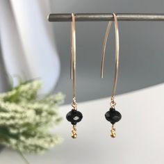 "Black Earrings, Dangle Earrings, Dainty Earrings, Boho Earrings, Bridesmaid Earrings, Everyday Earrings, Gold Earrings, Earrings for Women Bring a little bit of joy and sparkle to any outfit with our Black Onyx Earrings. The faceted roundel Onyx is hand wrapped in either 14K Gold Filled or Sterling Silver Wire and added to an elegant V- Shape ear wire. To add more movement and brightness we added a delicate silver/ gold filled round drop. These earrings are light enough for every day yet bold e Minimalist Teardrop Earrings For Party, Elegant Adjustable Nickel-free Teardrop Earrings, Dainty Hypoallergenic Earrings For Party, Minimalist Adjustable Hoop Earrings For Party, Dainty Dangle Threader Earrings For Party, Party Long Drop Threader Earrings, Elegant Pierced Teardrop Earrings With Adjustable Fit, Hypoallergenic Adjustable Earrings For Party, Minimalist Black Linear Earrings For Gifts