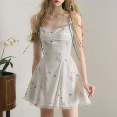 A strap dress depicting fluttering butterflies and fragrant flowers. A butterfly that looks like a living flower, dancing lightly on the wind. The hem is decorated with lace embroidery and the straps are decorated with ribbons. Try wearing the fantastical butterflies that live inside the flowers. 
 
 
 Size 
 
 S size
 
 Length: 78cm 
 Bust: 84cm 
 Waist: 64cm 
 
 
 M size
 
 Length: 79cm 
 Bust: 88cm 
 Waist: 68cm 
 
 
 L size
 
 Length: 80cm 
 Bust: 92cm 
 Waist: 72cm 
 
 
 
 
 
 
 
 
 Materia Gowns Dresses Elegant, Hair Haircuts, Korean Dress, Short Hair Haircuts, Dresses Elegant, Lace Embroidery, Strap Dress, Flat Shoes, Fashion Inspo Outfits