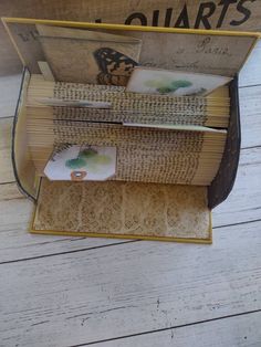 an open book sitting on top of a wooden table