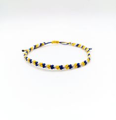 Mens nautical bracelet, Men bracelet, Surf bracelet, Beach bracelet,Macrame bracelet,Friendship bracelet,Navy blue and white This handknotted bracelet is made with navy blue,yellow and white waxed string. It is adjustable and has a sliding knot closure in order to fit a lot of sizes. Due to its waxed threads,the bracelet is very durable and water resistant. Width: 0.5cm / 0.2" Other bracelets in my shop: https://www.etsy.com/shop/LuckyRatJewellery?section_id=14498120&ref=shopsection_leftnav_2sho Rat Jewellery, Surf Bracelet, Nautical Bracelet, Beach Bracelet, Bracelet Macrame, Beach Bracelets, Bracelet Friendship, Men Bracelet, Bracelet Men