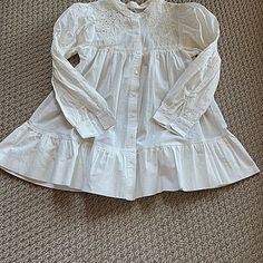 Cute Long Sleeve Baby Doll Style White Cotton Blouse/Top/Tunic. Size Xs. New Without Tags. Never Worn. Purchased Directly From Shein But Decided It Is Just Not My Style. Embroidery And Cutout Work With Puffy Sleeves. Gathered At Pit And Ruffled Again At Bottom Of Top. Buttons Down The Front. Band Sleeves With Smocking On Sleeve To Make Sleeve At Shoulder A Puffy Appearance. No Odors, Pulls, Pilling, Stains Or Any Other Flaws. Measurements: Length: 27 Inches Pit To Pit: 15 Inches Shoulder Seam To Flower Cut Out, Cutout Blouse, Tøp Aesthetic, White Cotton Blouse, Aesthetic Fits, Puffy Sleeves, Cotton Blouse, Shein Tops, Lace Flowers