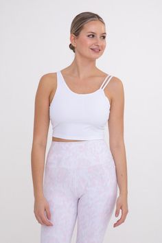 What will be your date's response when you show up in this Top? They're heart will instantly melt from your energy in it! You certainly chose the perfect moment for this top to make an appearance! Constructed from a compression spandex blend, this moderate support cropped bra top features built in bra support and asymmetrical neck straps. Wear to your next yoga class or pair with jeans for a sporty look. Moisture-wicking Four-way stretch Fabric: 87% nylon 13% spandex Ashley wears a Large Compression Tops For Light Exercise, Bra Friendly, Cropped Top With Built-in Bra For Light Exercise, Fitted Crop Top With Light Support For Exercise, Fitted Crop Top With Built-in Bra For Light Exercise, Cropped Top For Light Exercise, Fitted White Activewear With Removable Bra Pads, White Cropped Crop Top For Yoga, Crop Top With Built-in Bra For Light Exercise, White Medium Support Crop Top For Yoga