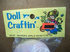 the package is wrapped in plastic and has an ad for doll craftin on it