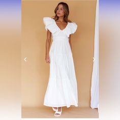 Never Worn - Perfect For Brides Or Summer Make A Statement In Our Gorgeous Kahlo Maxi Dress. Featuring A Bold Neckline And Maxi Length, It's Perfect For A Sunny Sunday Brunch With Your Besties. Team It With White, Strappy Heels And A Tote For A Look That Will Turn Heads. White Puff Sleeve Dress With Ruffles For Brunch, Chic White Puff Sleeve Dress With Ruffles, Puff Sleeve Ruffle Maxi Dress For Brunch, White Tiered Puff Sleeve Dress For Summer, Puff Sleeve Maxi Dress With Ruffles For Brunch, Elegant White Puff Sleeve Dress With Ruffle Hem, Chic Puff Sleeve Maxi Dress With Ruffles, Feminine Puff Sleeve Maxi Dress With Ruffles, White Puff Sleeve Dress With Ruffles For Day Out