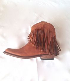 Western Boots With Tassels And Round Toe, Bohemian Suede Boots With Tassels, Western Suede Fringe Boots, Western Style Suede Boots With Fringe, Leather Fringe Boots For Rodeo, Leather Fringe Boots For Fall, Western Suede Boots With Tassels, Western Festival Boots With Tassels, Western Boots With Tassels For Festival