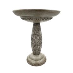 an ornately designed pedestal is shown against a white background for use as a centerpiece