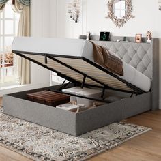 a bed that is sitting in the middle of a room with a mattress underneath it