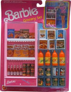 a barbie doll is standing in front of a toy display case with drinks and condiments