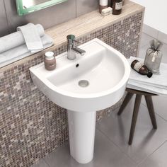 a white sink sitting under a bathroom mirror next to a wooden stool and towel rack