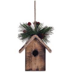 a wooden birdhouse with pine cones and berries hanging from it's side on a rope