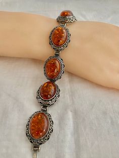 "Poland Amber Cabochons Filagree Vintage Bracelet 43.9 Grams 925 Sterling Silver Hallmark w/ Artist initial 925 Poland Measurements; Bracelet Length - 7.75\" x across 0.89\" Free shipping on all orders over $35.00 however if there is a return, buyer to refund seller for the free shipping cost paid by seller. Visit our shops HauteCoutureLaLa TrendsCouture BorrowedTrends BeautifulPatina LastingTrends" Classic Cabochon Bracelets As Gift, Classic Cabochon Bracelets For Gifts, Silver Oval Bracelets For Collectors, Antique Oval Sterling Silver Bracelets, Antique Silver Cabochon Bracelets, Antique Oval Sterling Silver Bracelet, Vintage Sterling Silver Cabochon Bracelets, Vintage Sterling Silver Bracelets With Cabochon, Handmade Oval Sterling Silver Bracelet In Vintage Style