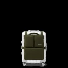 Crafted from high-quality nylon, the RIMOWA Cabin Luggage Harness in Khaki green streamlines the experience of traveling with hand luggage. Conveniently secured to your RIMOWA Cabin suitcase using adjustable straps, it boasts a clever formation of pockets and compartments that offer easy access to your essentials such as phones, electronics and toiletry pouches. Two large zipped pockets can each fit a laptop of up to 16" in size, or documents and magazines. The Luggage Harness is designed to fit the RIMOWA Original, Classic, Essential, Essential Lite and Hybrid suitcases in the following sizes only: Cabin U, Cabin S, Cabin and Cabin Plus. Rimowa Cabin, Cabin Suitcase, Travel Trunk, Cabin Luggage, Travel Capsule, Favorite Handbags, Toiletry Pouch, Carry On Suitcase, Accessories Packing