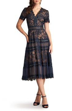 Lace and mesh collide to usher in an A-line dress with an elevated vision for the classic LBD—perfect for a candlelit dinner or night on the town. 50" length (size 8) Hidden back-zip closure V-neck Short sleeves Lined 52% polyester, 48% cotton Dry clean Imported Elegant Sheer A-line Midi Dress, Elegant Sheer Lace Evening Dress, Elegant Sheer Lace Midi Dress, Elegant Midi Length Lace Dress For Cocktail, Evening A-line Lace Midi Dress, Elegant Evening Tea Length Lace Dress, Formal A-line Sheer Midi Dress, Elegant Lace A-line Evening Dress, Lace Midi Dress For Evening In Tea Length