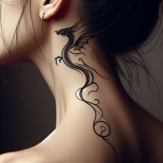 a woman with a dragon tattoo on her neck and behind her ear, looking down at the ground