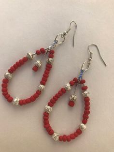 Handmade Earrings, Red, Silver Small Beads, Silver Wire Single Hoop Dangle Earrings. Red Wire Wrapped Dangle Earrings, Red Teardrop Beaded Earrings, Red Teardrop Hoop Earrings, Red Teardrop Hoop Earrings For Pierced Ears, Red Round Bead Earrings With Ear Wire, Red Hoop Earrings With Colorful Beads For Jewelry Making, Red Wire Wrapped Hoop Earrings, Red Dangling Beaded Earrings, Red Teardrop Beaded Earrings With Dangling Beads