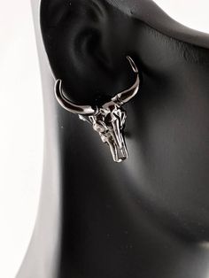 Show off your unique style with these Swarovski decorated Gunmetal Bull Skull Earring Studs.  Created to be paired with the King of Curses Necklace. Width: 2 cm Weight: 5 g Bull Peircings, Adjustable Black Skull Earrings, Edgy Skull-shaped Pierced Earrings, Edgy Skull-shaped Earrings For Gift, Adjustable Black Skull-shaped Earrings, Bull Skulls, Skull Earrings, Jewelry Earrings Studs, Unique Style