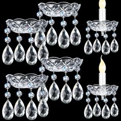 a set of crystal candle holders with candles