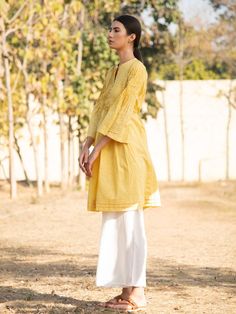 Yellow Printed Cotton Sunny Side Up Tunic Dress - Trendroots Traditional Yellow Tunic For Spring, Long Sleeve Yellow Kurta For Summer, Yellow Long Sleeve Summer Kurta, Traditional Yellow Spring Tunic, Spring Yellow Cotton Kurta, Yellow Cotton Dress With Chikankari Embroidery, Yellow Long Sleeve Kurta For Spring, Yellow Straight Kurta For Spring, Summer Long Sleeve Kurta With Yoke Detail