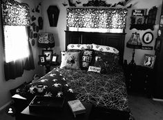 black and white bedroom with spider web bedding