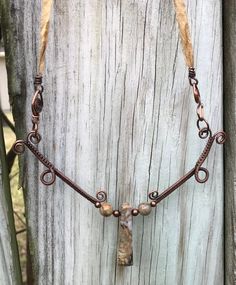 Stunning Woven Copper Necklace with Picasso Jasper and Copper Beads on a Silk Ribbon Cord. The Silk cord and handmade clasp measure 15 1/2" and the woven copper component is approximately 4" long 5" wide. This piece has been antiqued, polished and sealed. Sealed with Protectaclear. ProtectaClear is a clear, protective coating that is tough enough to protect jewelry and is safe for wear against skin. ProtectaClear is practically invisible once applied and will seal and protect jewelry from tarnis Bohemian Brown Electroformed Necklaces, Bohemian Brown Necklace With Copper Wire, Bohemian Brown Copper Wire Necklace, Adjustable Wire Wrapped Nature-inspired Necklace, Nature-inspired Adjustable Wire Wrapped Necklaces, Earthy Brown Wire Wrapped Necklaces, Earthy Brown Wire Wrapped Necklace, Earthy Brown Hand Wrapped Necklaces, Earthy Bronze Copper Necklaces