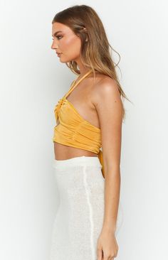 * Yellow Crop Top 
 * Halterneck styles are totally in this Summer () and this cute crop will be the perfect addition to your collection. Pair with a knit midi skirt () and platform sandals () for the ultimate boho, beach vibe! 
 * Tie up halter neck 
 * Ring detail at center bust 
 * Tie up cross over strap under bust 
 * Ruched side 
 * Fully lined 
 * Cropped length 
 * Midweight stretch material Ring Halter Top, Ring Halter, Yellow Ring, Neck Ring, Prom Midi Dress, Summer Playsuit, Yellow Crop Top, Knit Midi Skirt, Strapless Tops