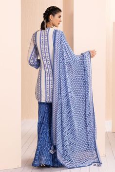 Blue embroidered crepe kurta with floral patterns. Comes with tiered sharara and a georgette dupatta, adorned with delicate lace and a printed border.
Components: 3
Pattern: Printed, Embroidered
Type Of Work: Floral
Neckline: Notched
Sleeve Type: Three Quarter
Fabric: Crepe, chiffon, georgette, chanderi
Color: Blue
Other Details: 
Tasseled neckline
Lace hem kurta
Occasion: Sangeet - Aza Fashions Blue Block Print Mulmul Sets, Indigo Sets With Dupatta For Navratri, Indigo Navratri Set With Dupatta, Wedding Mulmul Dupatta With Block Print, Blue Block Print Straight Kurta Salwar Kameez, Blue Chikankari Embroidered Dress With Traditional Drape, Blue Unstitched Saree Sets, Blue Mulmul Palazzo Set With Straight Kurta, Blue Semi-stitched Mulmul Dupatta