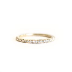 Fall in love with our 14k Solid Gold and Diamond Band Ring. Classy and timeless. A perfect gift for that special someone, or simply as a reminder to love yourself! The diamonds encompass just a little more than half way around the band. .20 Carats, SI Quality Near Colorless Diamond Material: 14k Solid Gold and Genuine and ethically sourced Diamonds Eternity Diamond Band, Band Diamond Ring, Minimalist Silver Ring, Wedding Band Diamond, Ring Inspiration, Fall Rings, Stackable Rings Silver, Diamond Band Ring, Gold Diamond Wedding Band