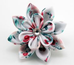 A flower is made in the technique of tsumami kanzashi. Flower is made from satin ribbons . Flower's d ~ 1 inch (2-3 cm). More lapels see here: https://www.etsy.com/shop/JuLVa?section_id=11777522&ref=shopsection_leftnav_4 Avalaible in 6 colors My handworks can be a unique gift for you, your family and friends! For more items, please visit my shop home: http://www.etsy.com/shop/JuLVa Please be aware that orders are sent via standard delivery. Standard delivery from Latvia does not include a tr White Handmade Flowers Lapel Pin For Gifts, White Handmade Flowers Lapel Pin As Gift, Handmade Flower Lapel Pin For Gifts, White Flower Pins As Gifts, White Flower Pins For Gifts, White Flower Pins For Wedding, White Flower-shaped Wedding Pins, Handmade Flower Pins For Gifts, Flower Shaped Wedding Pins With Flower Decoration