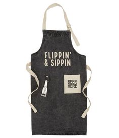 a black apron with white writing on it that says flippin'and sippin