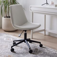 a white desk chair sitting on top of a rug