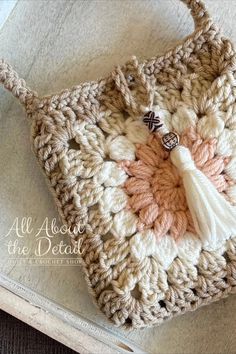 a crocheted bag with a tassel on it