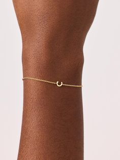 Personalize your stack with this dainty initial bracelet. Crafted in recycled sterling silver and dipped in 14k gold, this bracelet features a dainty chain and delicate letter pendant. The perfect addition to your wrist, this bracelet adds the perfect personal touch to your look. Pair it with our Staple Stack Bundle for an easy everyday look. • Dipped in 14k gold • Dainty bracelet with letter pendant • Lightweight & comfortable design Initial Bracelet Gold, Minimal Look, Letter Bracelet, Dainty Bracelet, Dainty Chain, Comfortable Design, Initial Bracelet, Gold Initial, Dainty Bracelets