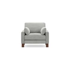 a light gray chair with two pillows on the armrests and a white background