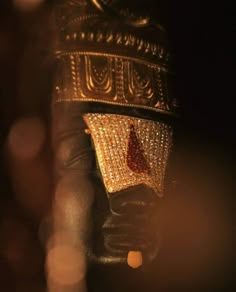 a close up view of a gold and diamond hat