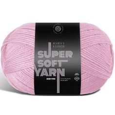 the knitting yarn ball is pink and has a black label that says, super soft yarn