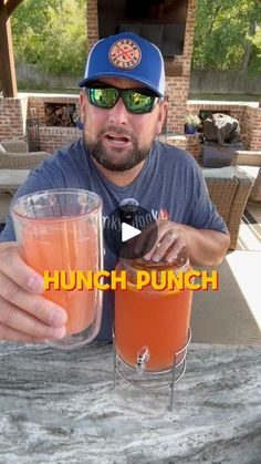 a man sitting at a table with a drink in front of him and the caption reads lunch punch