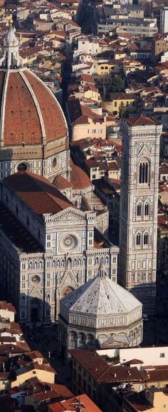 an aerial view of the cathedrals and buildings in bologna, italy on a sunny day