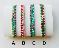 The Vintage Christmas Collection.  Choose your favorite set or sets from the Vintage Christmas bracelet collection.  Each set includes 3 bracelets.  Buy one set or a whole stack! These colorful seed bead stretch bracelets will bring joy and happiness to your Christmas season.  Perfect for both wearing and sharing!  A wonderful way to spread Christmas cheer! Create your Vintage Christmas collection by ordering sets. The bracelet sets are labeled Set A, B, C, D.  When you place your order, please Seed Bead Stretch Bracelets, Seed Bracelets, Bead Stretch Bracelets, Bracelet Sets, Christmas Bracelet, A B C D, Bead Bracelets, Seed Bead Bracelets, Christmas Collection