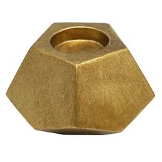 an octagonal brass metal object on a white background