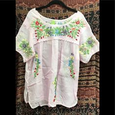 Cotton Short Sleeve Bohemian Embroidered Relaxed Fit Blouse, Spring Multicolor Embroidered Peasant Top, Casual Floral Embroidered Blouse For Vacation, Spring Bohemian Crew Neck Blouse, Casual Floral Embroidered Tunic Top, Peasant Style Embroidered Top For Vacation, Spring Beach Peasant Style Embroidered Top, Bohemian Embroidered Peasant Top For Daywear, Spring Folk Tunic Peasant Top