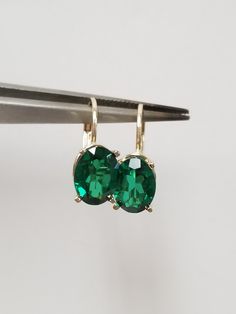 "Thanks for shopping our vintage estate store. We tend to sell well below wholesale and truly hope you enjoy all of our items. Many of the items are one of a kind, so please enjoy scrolling through the pictures and hopefully something will catch your eye. Brown spots are from reflections or camera. Nice estate 14k yellow gold created 3ct emerald lever back earrings. Gems are testing natural, but the are created. Retail $399 on sale $239 Length: 5/8\" 12mm Width: 1/4\" 5.5mm Weight: 1.78 grams Ca Classic Emerald Earrings For Formal Occasions, Classic Formal Emerald Earrings, Classic Green Clip-on Earrings, Classic Emerald Earrings With Prong Setting, Classic Emerald Earrings For Anniversary, Vintage High Quality Jewelry For Formal Occasions, Vintage Emerald Earrings For Anniversary, Classic Oval Earrings For Collectors, Classic Green Earrings For Anniversary