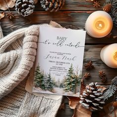 baby it's cold outside party with pine cones, candles and knitted sweater