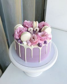 there is a cake with flowers and icing on it